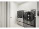 Laundry room with modern washer and dryer at 10025 Scottish Pines Ct, Orlando, FL 32832