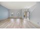 Spacious living room with wood-look floors, neutral walls and stairs at 10025 Scottish Pines Ct, Orlando, FL 32832