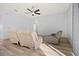 Bright living room featuring light walls, wood-look floors, and comfy seating at 10025 Scottish Pines Ct, Orlando, FL 32832