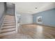 Light and airy living room with wood-look flooring and neutral walls at 10025 Scottish Pines Ct, Orlando, FL 32832