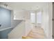 Upstairs hallway with light walls and wood-look floors at 10025 Scottish Pines Ct, Orlando, FL 32832