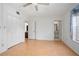 Large bedroom with hardwood floors, double closets, and access to bathroom at 117 N Garfield Ave # 1, Deland, FL 32724