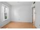 Spacious bedroom with hardwood floors and large window at 117 N Garfield Ave # 1, Deland, FL 32724