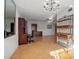 Bright dining area with hardwood floors, chandelier, and built-in shelving at 117 N Garfield Ave # 1, Deland, FL 32724