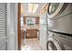 Efficient kitchen with appliances, ample cabinetry, and a view from the window at 117 N Garfield Ave # 1, Deland, FL 32724