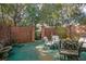 Relaxing courtyard patio with seating and brick wall at 117 N Garfield Ave # 1, Deland, FL 32724