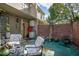 Inviting patio with seating area and brick wall at 117 N Garfield Ave # 1, Deland, FL 32724