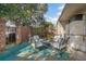 Private brick patio with seating area and lush landscaping at 117 N Garfield Ave # 1, Deland, FL 32724