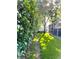 Landscaped backyard with lush green grass and manicured greenery at 12 Peruvian Ln, Ormond Beach, FL 32174