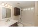 Neutral bathroom features a modern vanity, mirror, and shower/tub combo at 12 Peruvian Ln, Ormond Beach, FL 32174