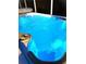 Inviting hot tub with illuminated blue water at 12 Peruvian Ln, Ormond Beach, FL 32174