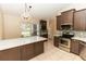 Spacious kitchen with an island and stainless steel appliances at 12 Peruvian Ln, Ormond Beach, FL 32174