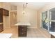Modern kitchen with island, dark cabinets, and quartz countertops at 12 Peruvian Ln, Ormond Beach, FL 32174