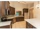 Modern kitchen with dark cabinets and quartz countertops at 12 Peruvian Ln, Ormond Beach, FL 32174