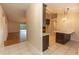 Open kitchen features island with seating and modern cabinetry at 12 Peruvian Ln, Ormond Beach, FL 32174