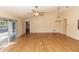 Spacious living room with hardwood floors and access to patio at 12 Peruvian Ln, Ormond Beach, FL 32174