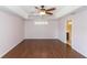 Main bedroom with hardwood floors and access to bathroom at 12 Peruvian Ln, Ormond Beach, FL 32174