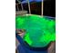Swim spa with green light illumination at night at 12 Peruvian Ln, Ormond Beach, FL 32174