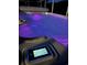 Swim spa with purple light illumination at night at 12 Peruvian Ln, Ormond Beach, FL 32174