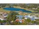 Aerial view of community clubhouse, golf course, and lake at 1278 Chessington Cir, Lake Mary, FL 32746