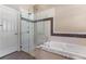 Bathroom with a glass-enclosed shower, soaking tub, and tiled accents, offering a spa-like experience at 1278 Chessington Cir, Lake Mary, FL 32746