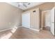 Neutral bedroom with wood floors, white closet doors, and good lighting, offering a simple and elegant space at 1278 Chessington Cir, Lake Mary, FL 32746