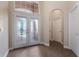 Bright and airy foyer with double doors and tile flooring at 1278 Chessington Cir, Lake Mary, FL 32746