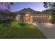 Charming home with a well-manicured lawn, mature landscaping, and an inviting entryway at 1278 Chessington Cir, Lake Mary, FL 32746