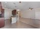 Modern kitchen with tile floors, granite counters, stainless appliances, and open access to the living space at 1278 Chessington Cir, Lake Mary, FL 32746