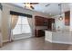 Eat-in kitchen with granite counters, dark wood cabinets and stainless steel appliances at 1278 Chessington Cir, Lake Mary, FL 32746