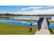 Serene lakefront view with birds and a dock at 1278 Chessington Cir, Lake Mary, FL 32746