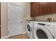 Laundry room with washer, dryer, and cabinets at 1278 Chessington Cir, Lake Mary, FL 32746