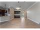 Bright, open living area featuring hardwood floors and seamless flow into the kitchen at 1278 Chessington Cir, Lake Mary, FL 32746