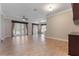 Spacious living room with hardwood floors, and seamless flow into the kitchen and french doors at 1278 Chessington Cir, Lake Mary, FL 32746