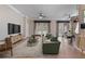 Bright, open living room featuring hardwood floors, neutral colors, and stylish modern furniture at 1278 Chessington Cir, Lake Mary, FL 32746