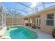 Inviting screened-in pool with covered patio area and outdoor seating, perfect for relaxation at 1278 Chessington Cir, Lake Mary, FL 32746