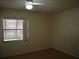 Bright bedroom featuring wood floors and window at 130 Jasmine Woods Ct # 15C, Deltona, FL 32725