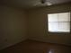 Simple bedroom with wood floors and window coverings at 130 Jasmine Woods Ct # 15C, Deltona, FL 32725