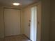 Bright entryway with tile flooring, double closets, and exterior door at 130 Jasmine Woods Ct # 15C, Deltona, FL 32725