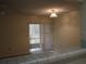 View from kitchen to screened porch with sliding glass door at 130 Jasmine Woods Ct # 15C, Deltona, FL 32725