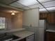 Small kitchen with white appliances and light-colored countertops at 130 Jasmine Woods Ct # 15C, Deltona, FL 32725