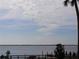 Peaceful waterfront view with people enjoying the scenery at 130 Jasmine Woods Ct # 15C, Deltona, FL 32725