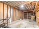 Unfinished garage interior with storage shelving and workbench at 1321 Spring Lake Rd, Fruitland Park, FL 34731