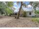 Large backyard with mature trees and a shed at 1579 Dunlap Dr, Deltona, FL 32725