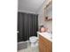 Clean bathroom with a shower/tub combo and wood vanity at 1579 Dunlap Dr, Deltona, FL 32725