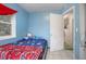 Small bedroom with a twin-size bed and blue walls at 1579 Dunlap Dr, Deltona, FL 32725