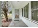 Front porch with security door and large windows at 1579 Dunlap Dr, Deltona, FL 32725