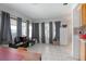 Bright living room with tile floors and large windows at 1579 Dunlap Dr, Deltona, FL 32725