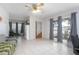 Living room with tile floors and ceiling fan at 1579 Dunlap Dr, Deltona, FL 32725