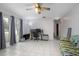 Living room with tile floors and large windows at 1579 Dunlap Dr, Deltona, FL 32725